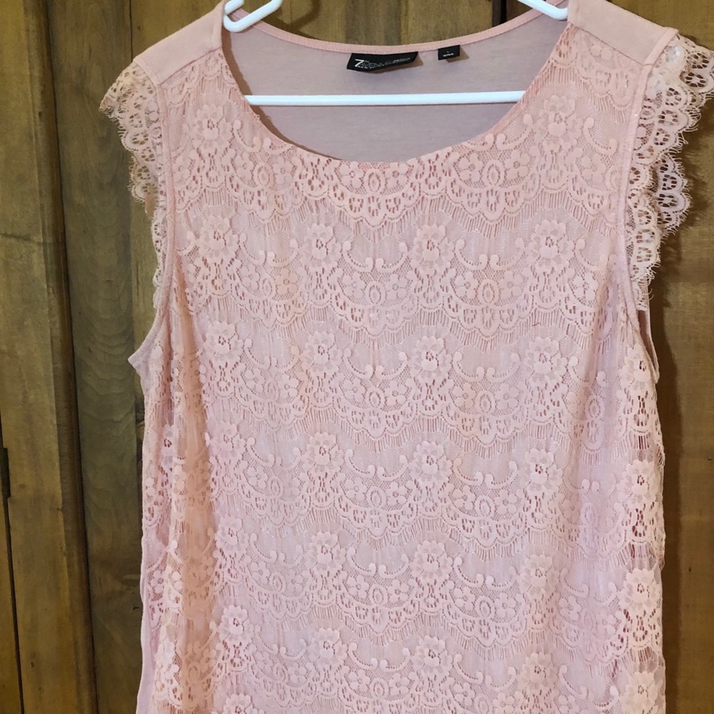 Pink lace blouse.